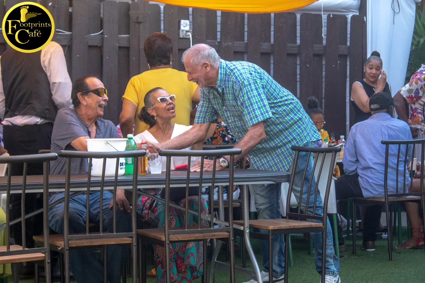 Greeting friends at Footprints Cafe